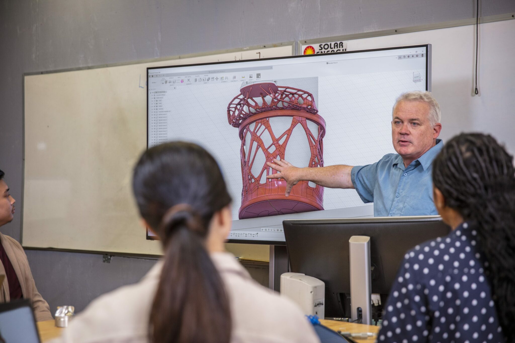 Workshop in the CNC lab at Diablo Valley College in Pleasant Hill, California. Students and teachers are working with Fusion 360.